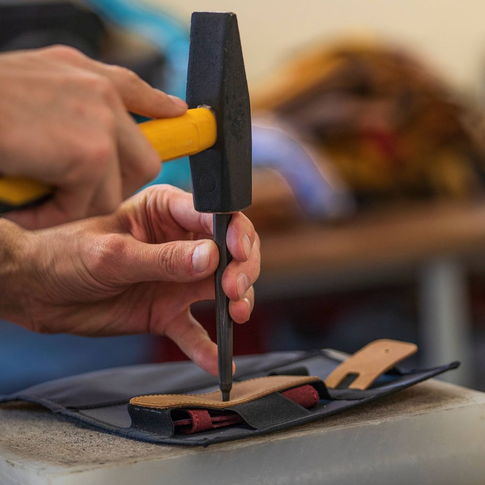 Punching holes in leather by hand